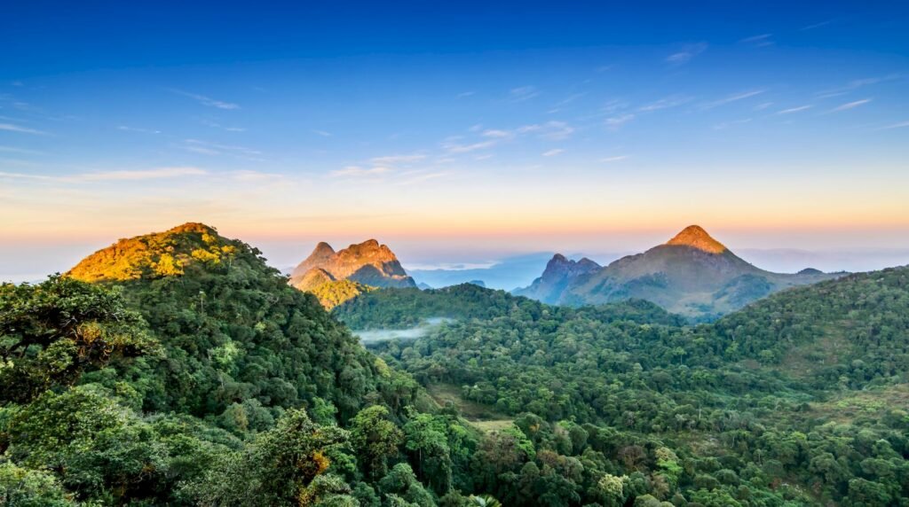 Limestone peaks of Doi Chiang Dao rising above lush jungle at golden hour