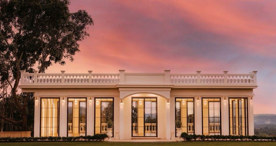 Bloomemories building facade at pink dusk